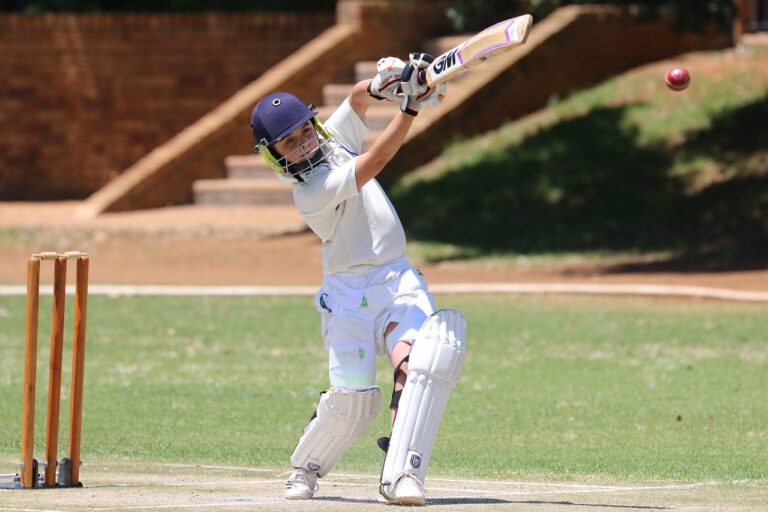 a teenager playing cricket